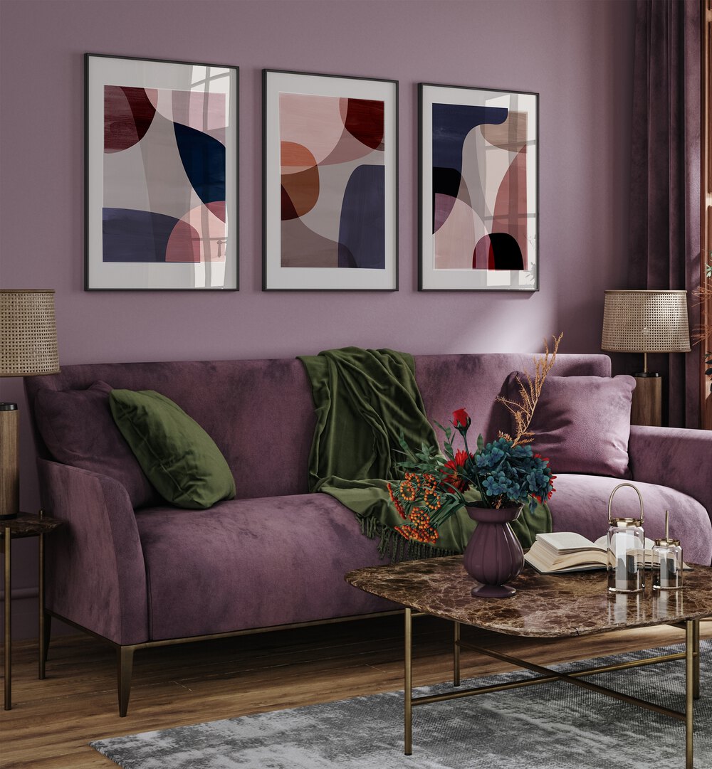Stylish living room featuring the ABSTRACT HARMONY SET, SET OF 3 PAINTINGS, enhancing modern home decor.
