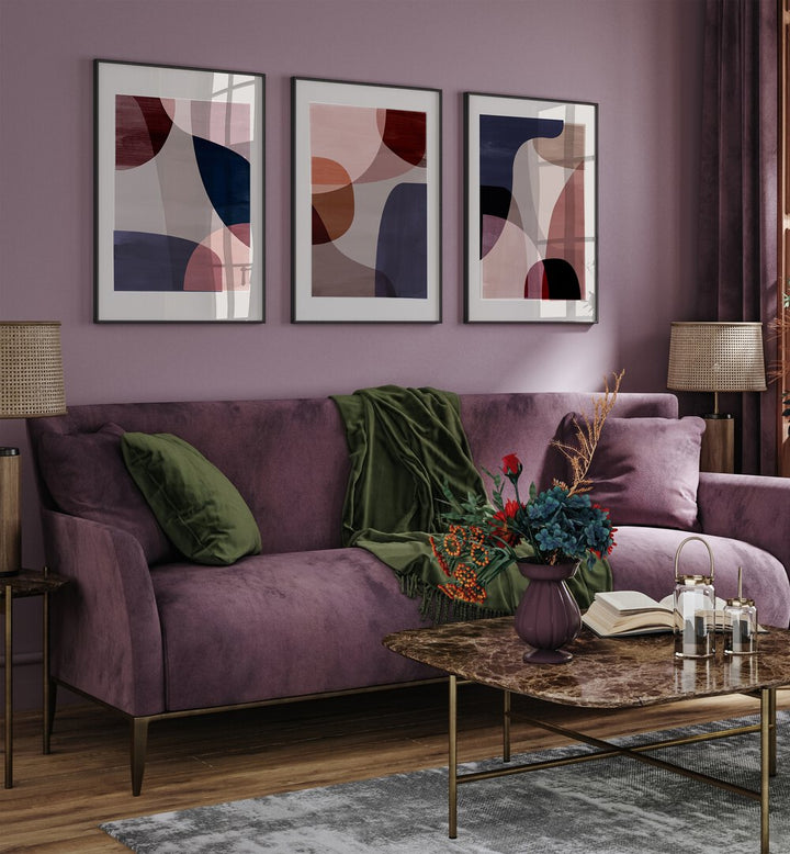 Stylish living room featuring the ABSTRACT HARMONY SET, SET OF 3 PAINTINGS, enhancing modern home decor.
