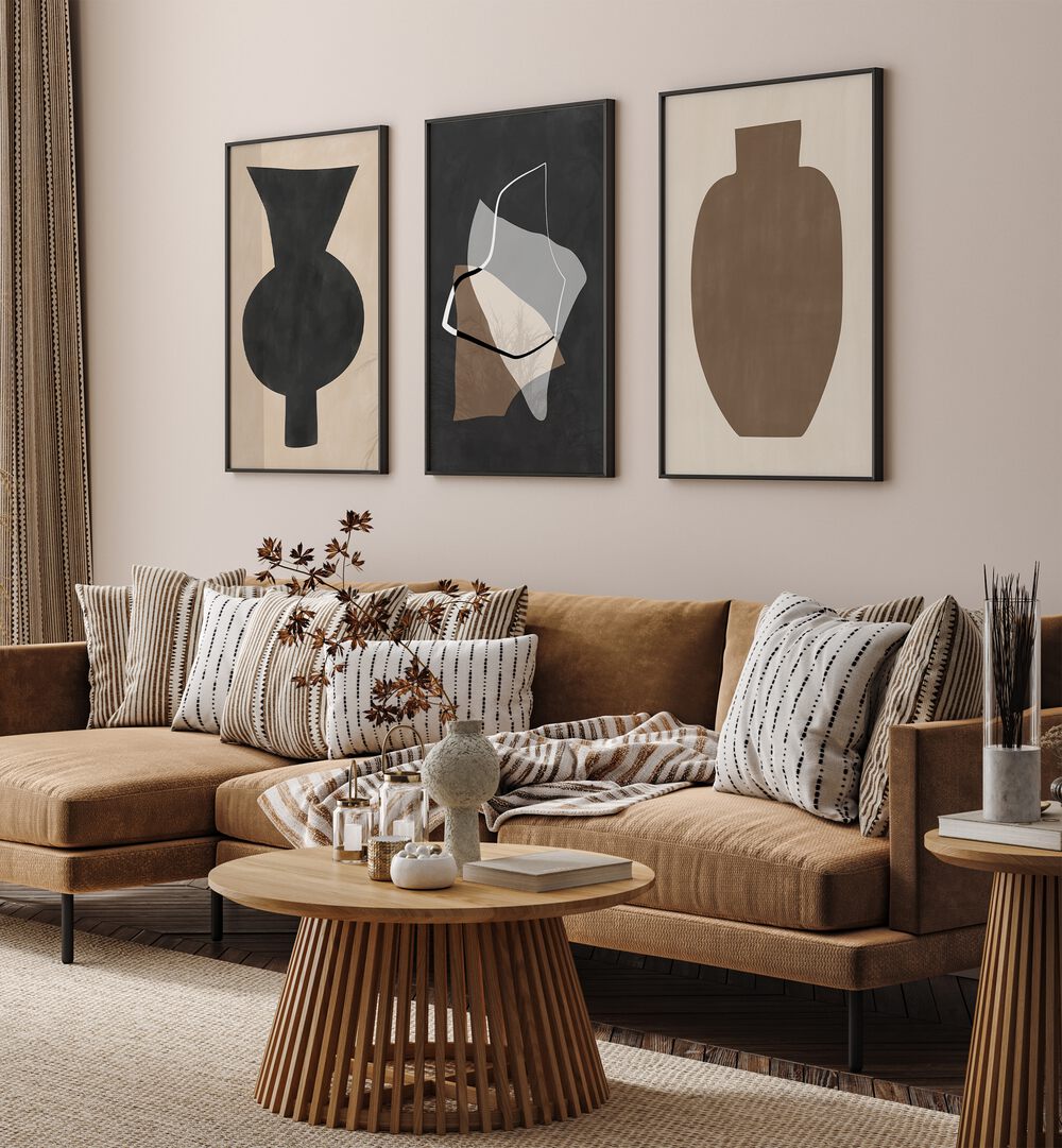 Stylish living room showcasing the EARTHEN ELEGANCE SET, SET OF 3 PAINTINGS with earthy tones and organic forms.