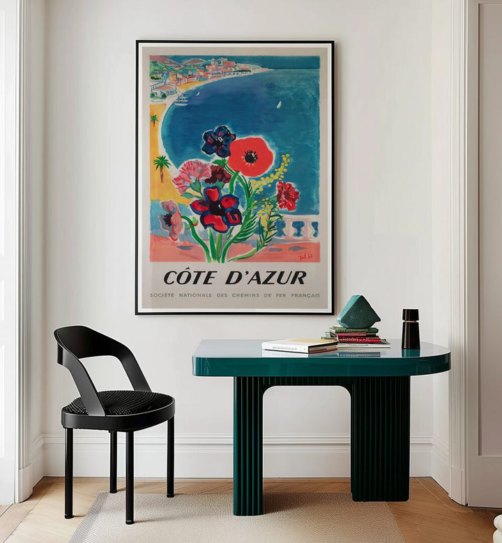 COTE D'AZUR, VINTAGE TRAVEL POSTERS adorn a stylish interior, capturing the allure of the French Riviera.