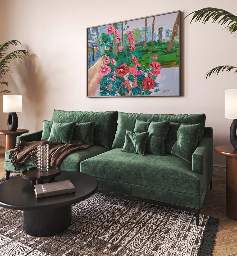 VIBRANT PINK FLOWERS, FLORAL FLOWER PAINTINGS adorn a stylish living room with a green sofa and modern decor.