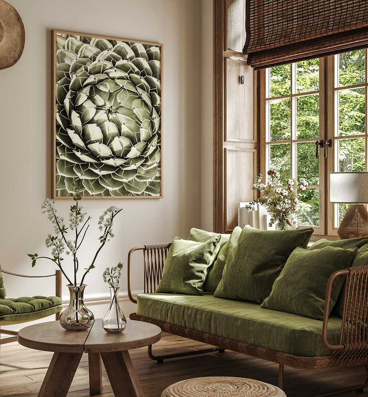 Cozy living room with framed GEOMETRIC SUCCULENT , FLORAL FLOWER PAINTINGS over green velvet sofa