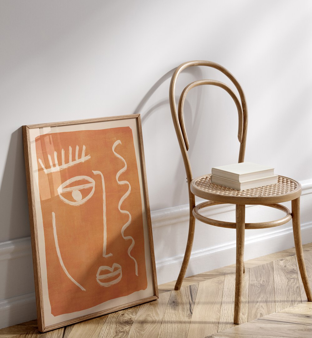 Stunning ABSTRACT FACE PORTRAIT, BOHO ART PAINTINGS leaning against a chair, perfect for bohemian interiors.