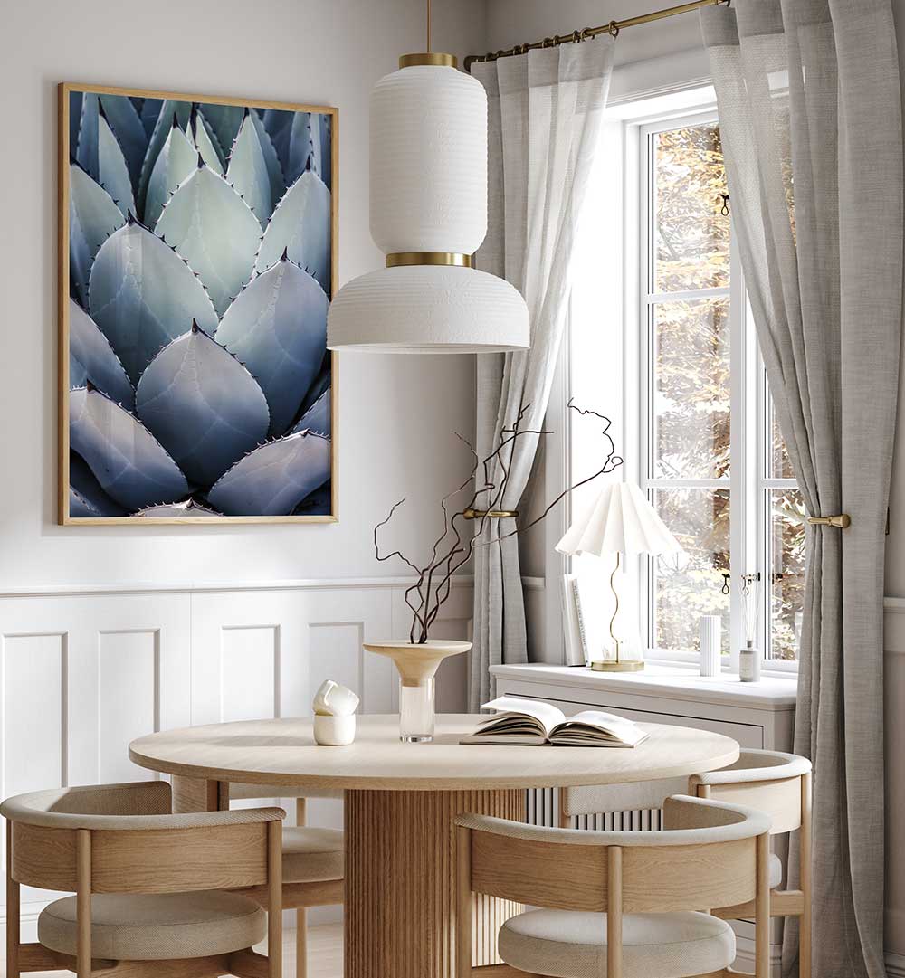 AGAVE GEOMETRY , FLORAL FLOWER PAINTINGS blue-green agave botanical wall art above wooden dining table in light neutral room