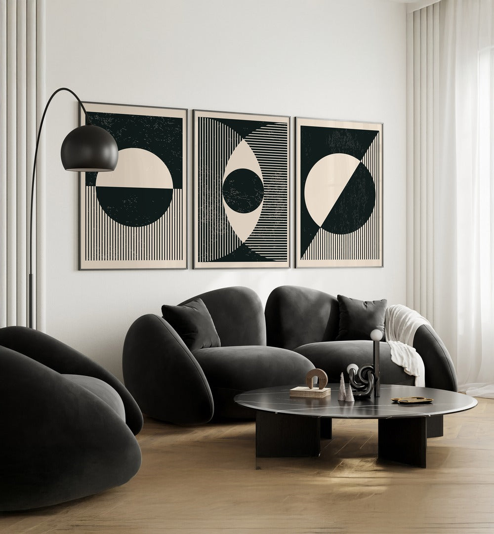 Stylish living room featuring the BLACK AND WHITE PLANETS SET, SET OF 3 PAINTINGS for a celestial home decor touch.
