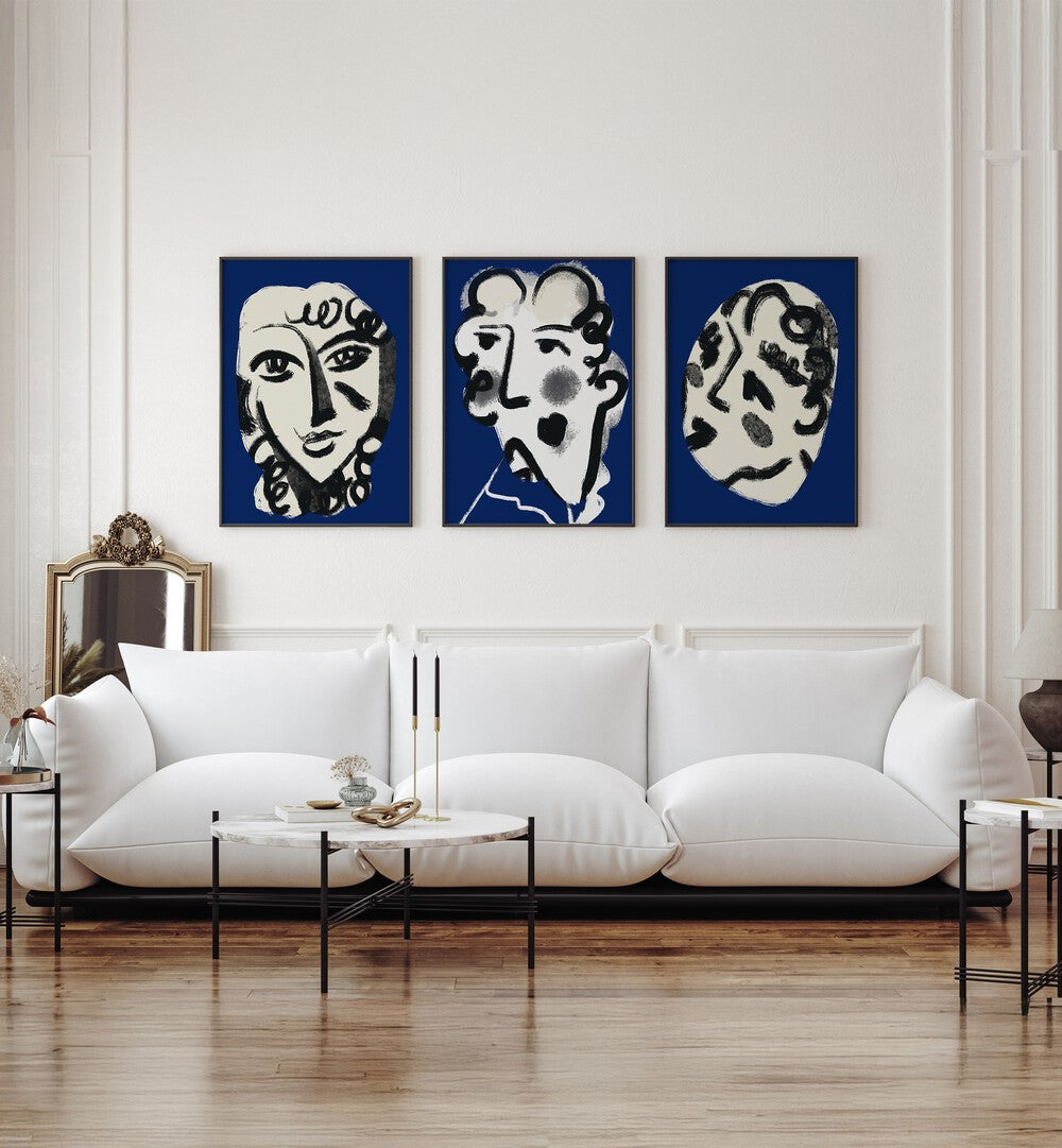 LUMINOUS EMBER SET, SET OF 3 PAINTINGS enhances a stylish living room with unique artistic flair.
