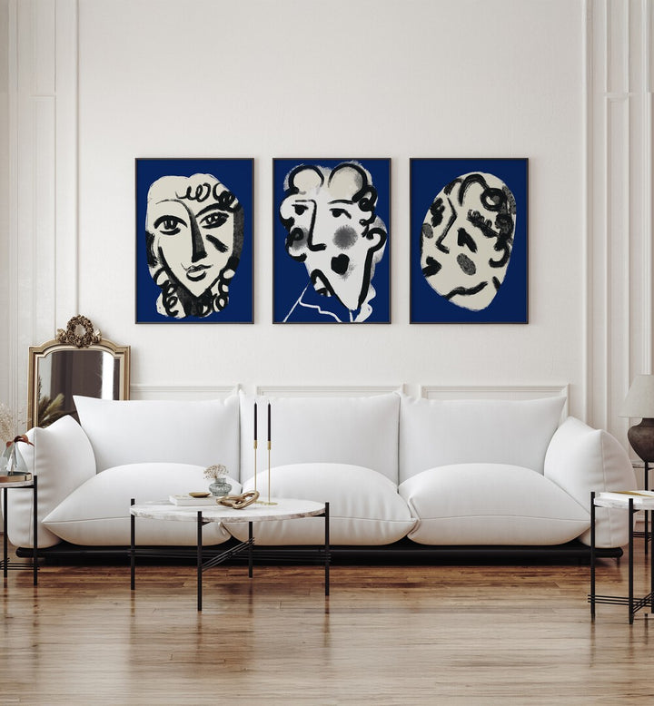 LUMINOUS EMBER SET, SET OF 3 PAINTINGS enhances a stylish living room with unique artistic flair.