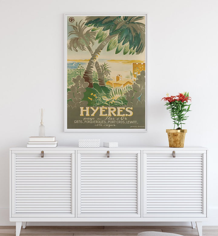 Brightly colored HYERES, VINTAGE TRAVEL POSTERS adorn a stylish living space, evoking the charm of Hyères, France.