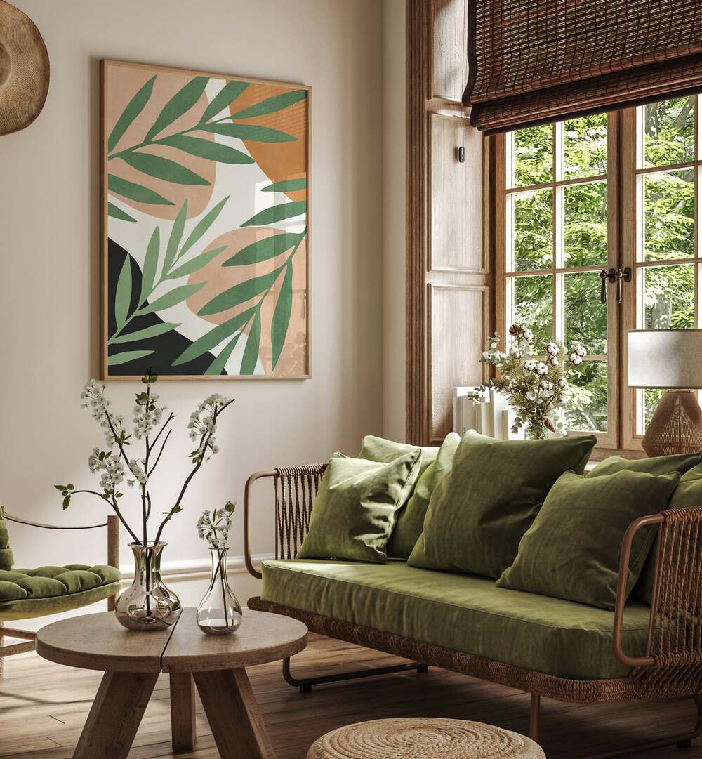 TROPICAL V, BOHO ART PAINTINGS showcase vibrant tropical leaves elegantly framed in a stylish living room setting.