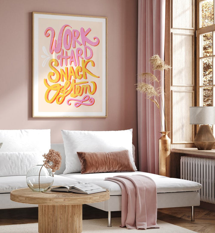 Motivational WORK HARD SNACK, QUOTES poster enhancing a stylish living room, perfect for inspiring ambition.