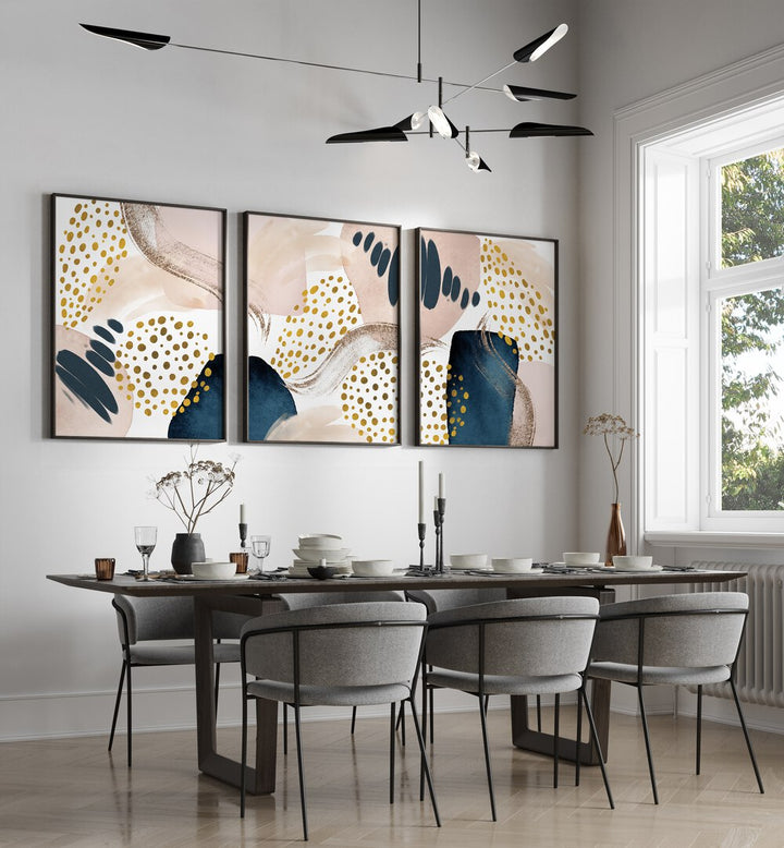 Elegant dining space featuring the ABSTRACTION SMOOTHNESS SET, SET OF 3 PAINTINGS for a modern touch.