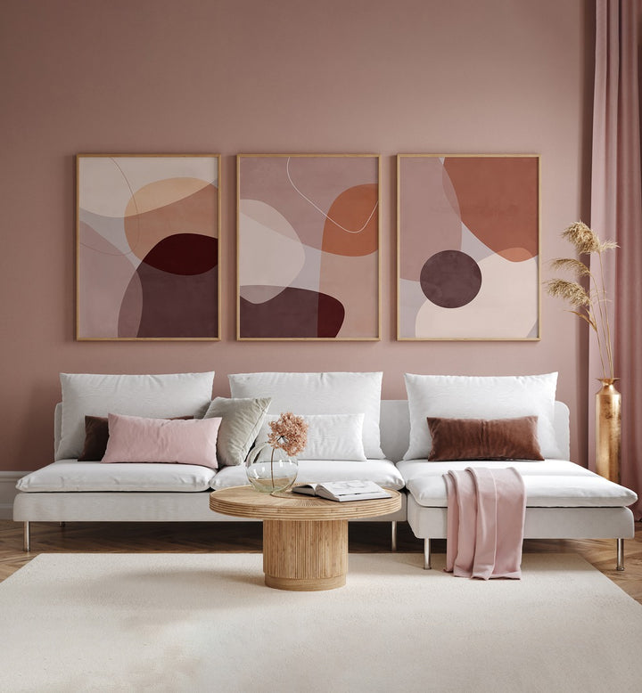 Elegant living room featuring the ABSTRACT MOCHA MIRAGE SET, SET OF 3 PAINTINGS, adding sophistication and tranquility.