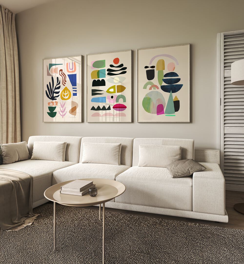 Stylish living room featuring the ABSTRACT NORD SET, SET OF 3 PAINTINGS, enhancing modern home decor with vibrant colors.