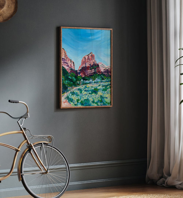 Angels Landing By Key And Sea Creative Travel Poster in Oak Wood Plain Frame on a grey wall beside a bicycle
