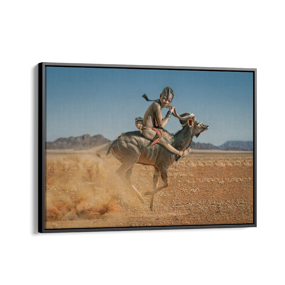 Dynamic EASY RIDER photography print capturing a child riding a gazelle in a stunning desert landscape.