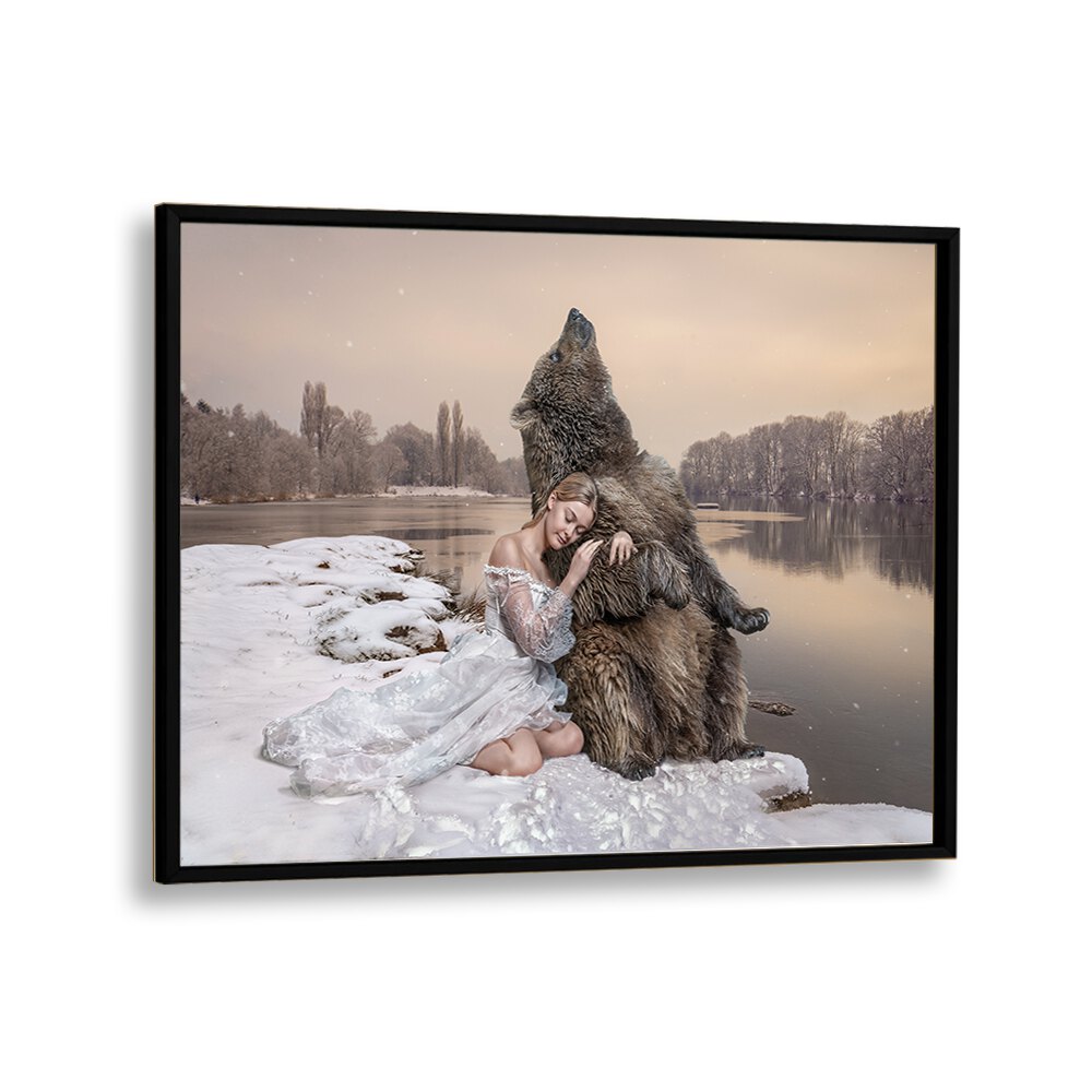 CUDDLING BEAR, PHOTOGRAPHY PRINTS showcase a serene moment between a woman and a bear by a tranquil lake in winter.