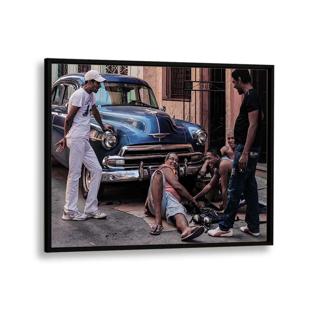Capturing the essence of community, this REPAIRING A CAR, PHOTOGRAPHY PRINTS showcases urban artistry in action.