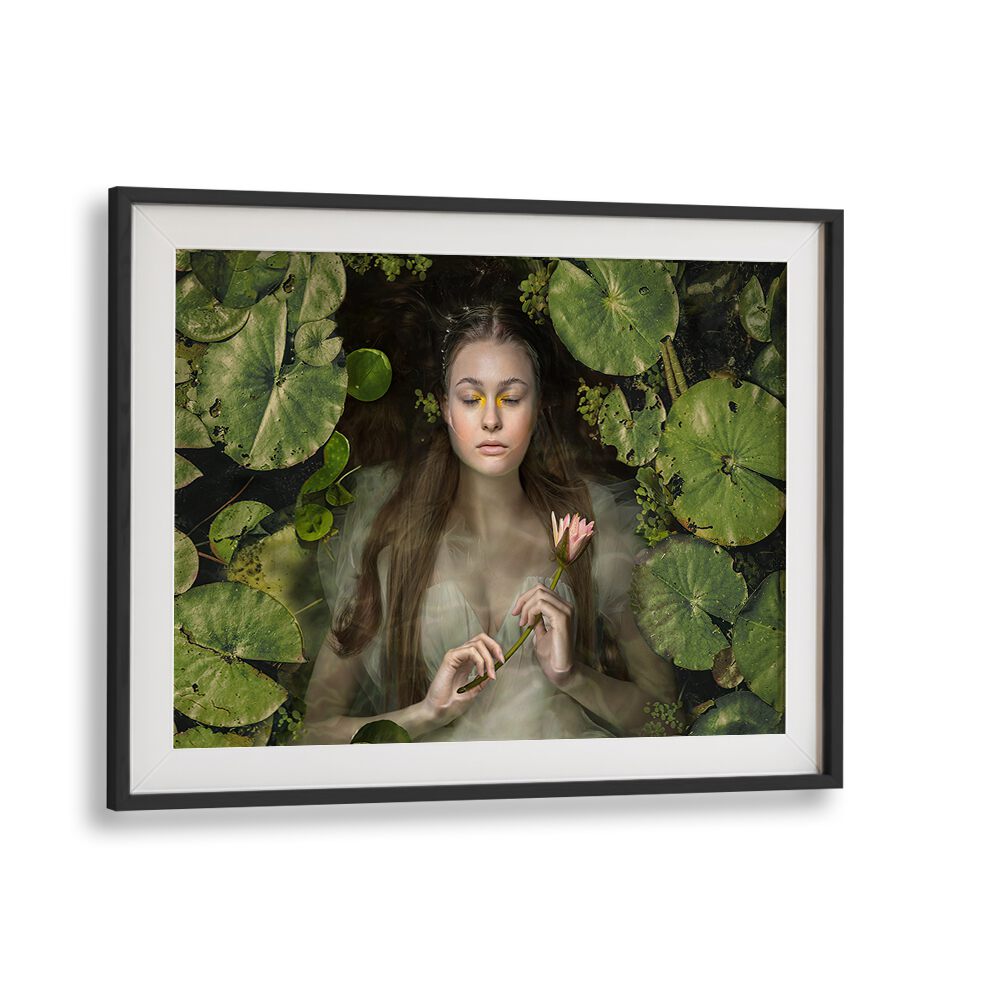 Serene portrayal of a woman among lily pads, featured in the SILENT DREAM, PHOTOGRAPHY PRINTS collection.