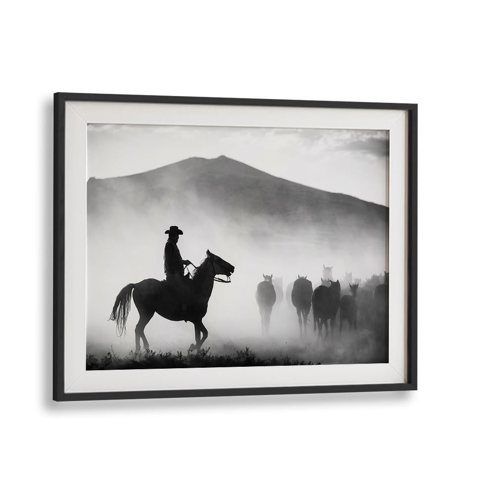 Silhouetted cowboy leading horses through misty landscapes in "HIS TERRITORY! , PHOTOGRAPHY PRINTS" collection.
