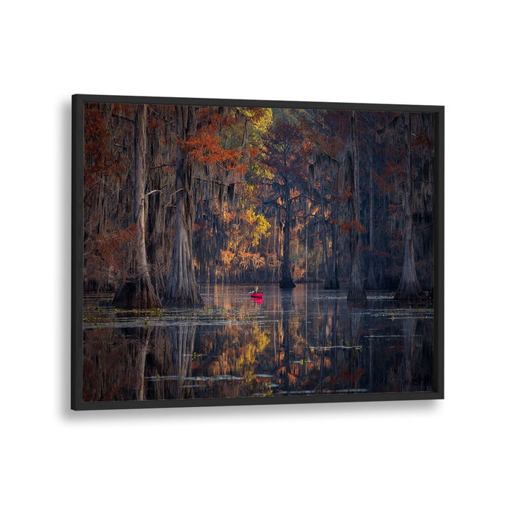 Colorful autumn trees reflect in calm waters, featuring a kayaker, perfect for CADDO LAKE 2023, PHOTOGRAPHY PRINTS.