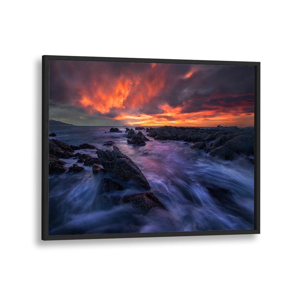 Stunning BURNING SKY, PHOTOGRAPHY PRINTS capturing vibrant sunset colors over rocky coastlines, perfect for any space.