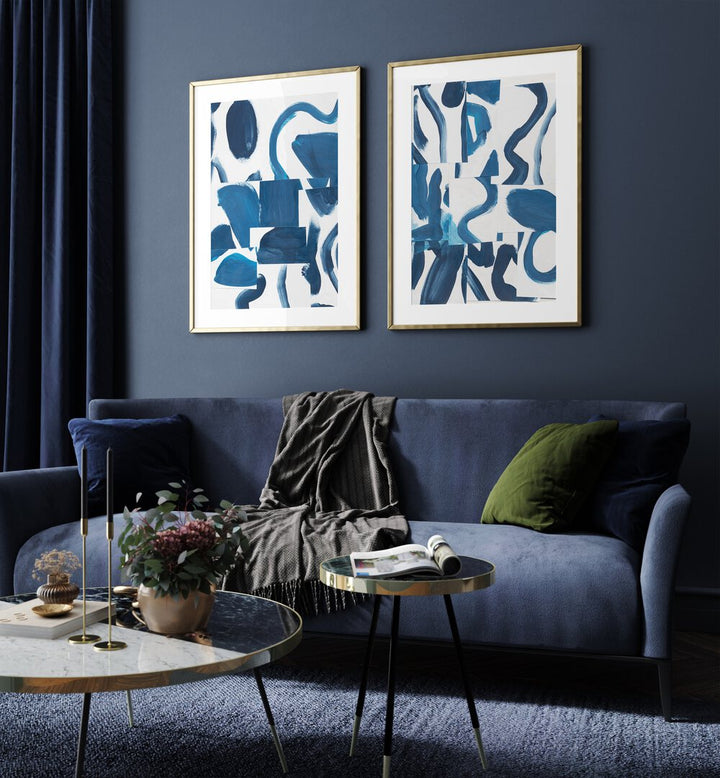 Elegant living room featuring the BLUE ABSTRACT SET, SET OF 2 PAINTINGS, showcasing bold blue brushstrokes.