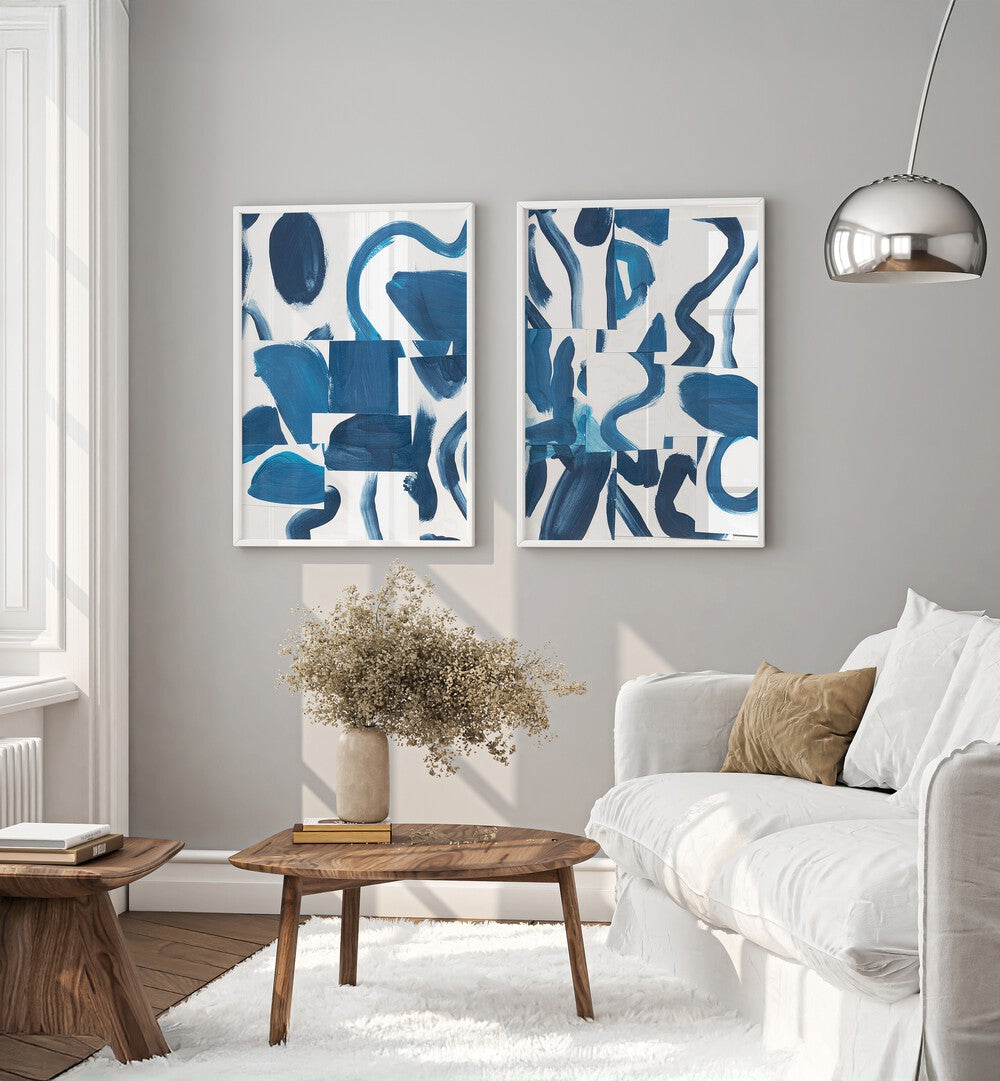 Transform your space with the BLUE ABSTRACT SET, SET OF 2 PAINTINGS featuring elegant blue brushstrokes.