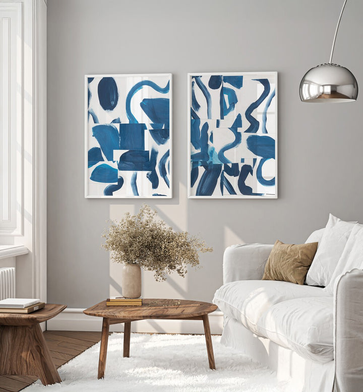 Transform your space with the BLUE ABSTRACT SET, SET OF 2 PAINTINGS featuring elegant blue brushstrokes.
