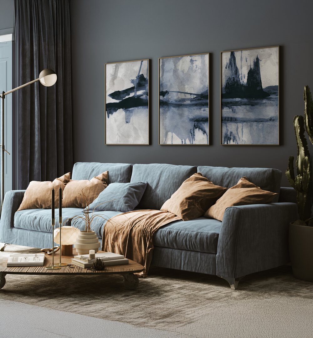 Stylish living room featuring the BLUE STROKES SET, SET OF 3 PAINTINGS, enhancing decor with elegant blue hues.