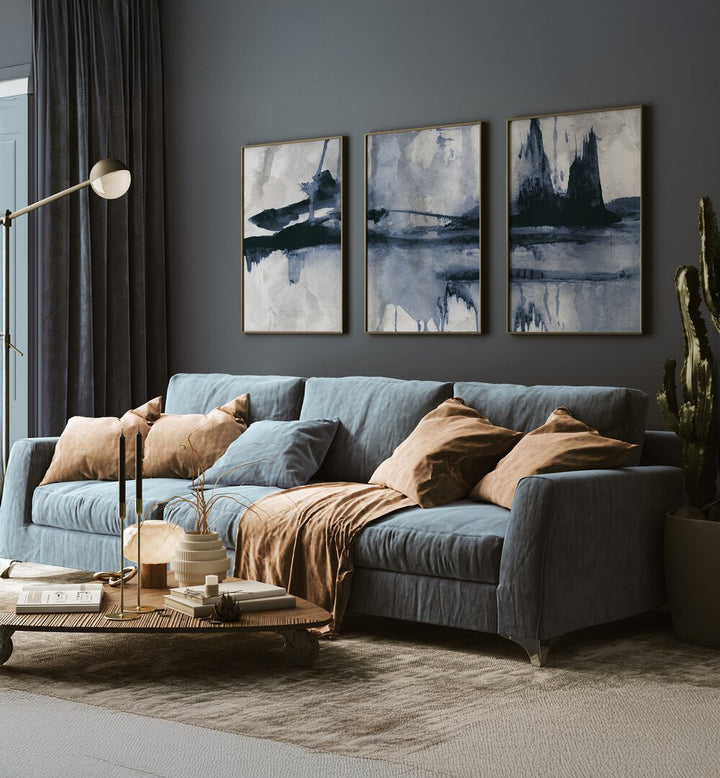Stylish living room featuring the BLUE STROKES SET, SET OF 3 PAINTINGS, enhancing decor with elegant blue hues.