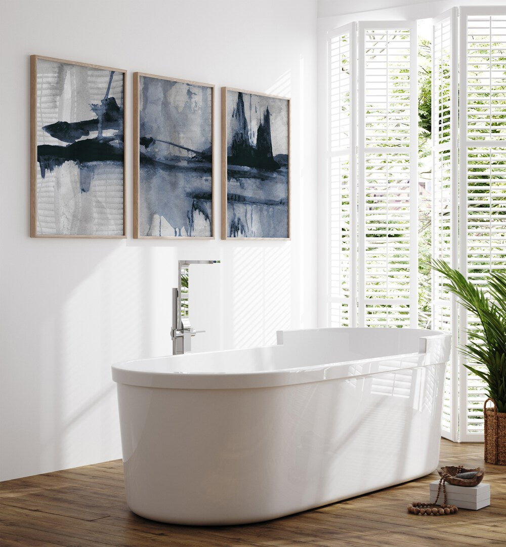Stylish bathroom featuring the BLUE STROKES SET, SET OF 3 PAINTINGS, enhancing decor with elegant blue hues.