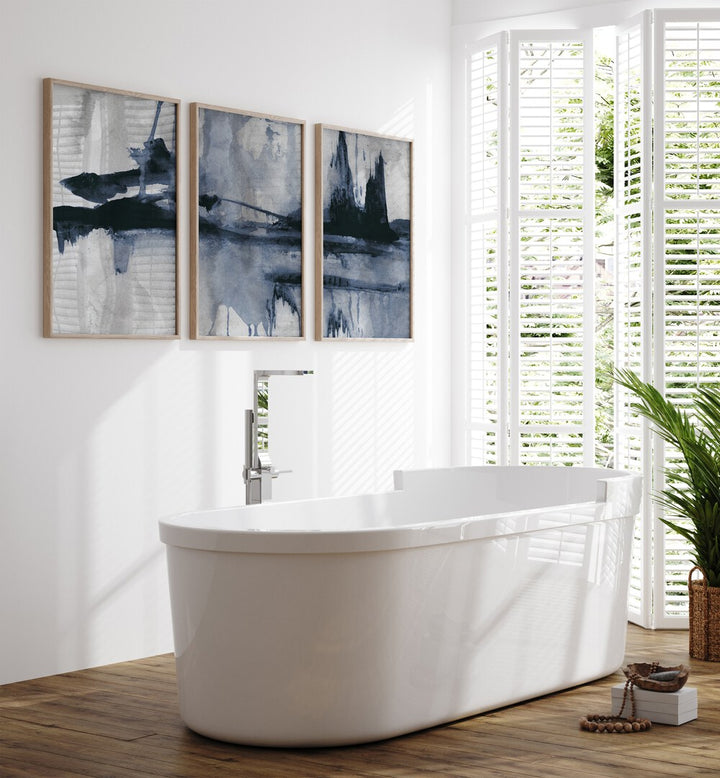 Stylish bathroom featuring the BLUE STROKES SET, SET OF 3 PAINTINGS, enhancing decor with elegant blue hues.