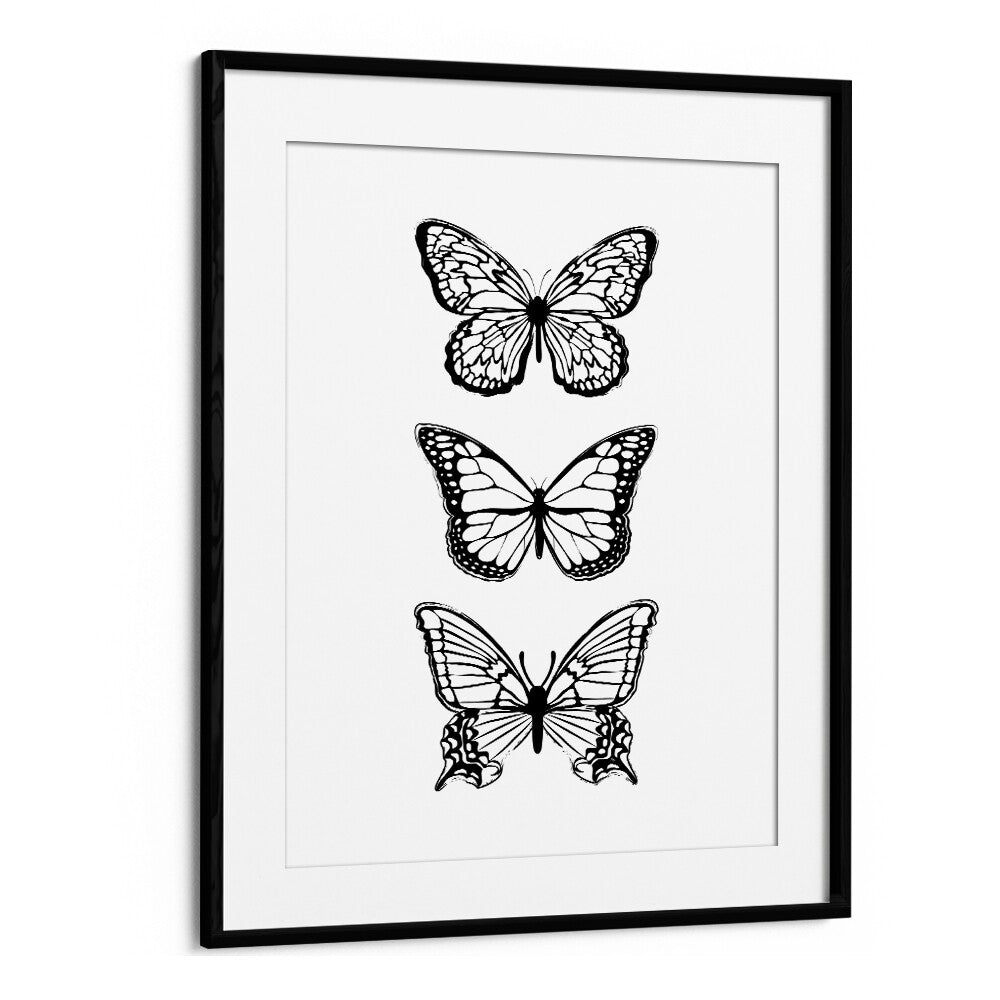 Elegant black butterflies in a stylish frame, perfect for fashion enthusiasts. Discover BLACK BUTTERFLIES, FASHION POSTERS.