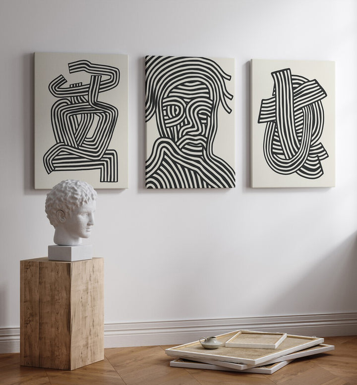 Stylish living room featuring ABSTRACT LINES INFINITY, SET OF 3 PAINTINGS, enhancing sophistication and artistic flair.