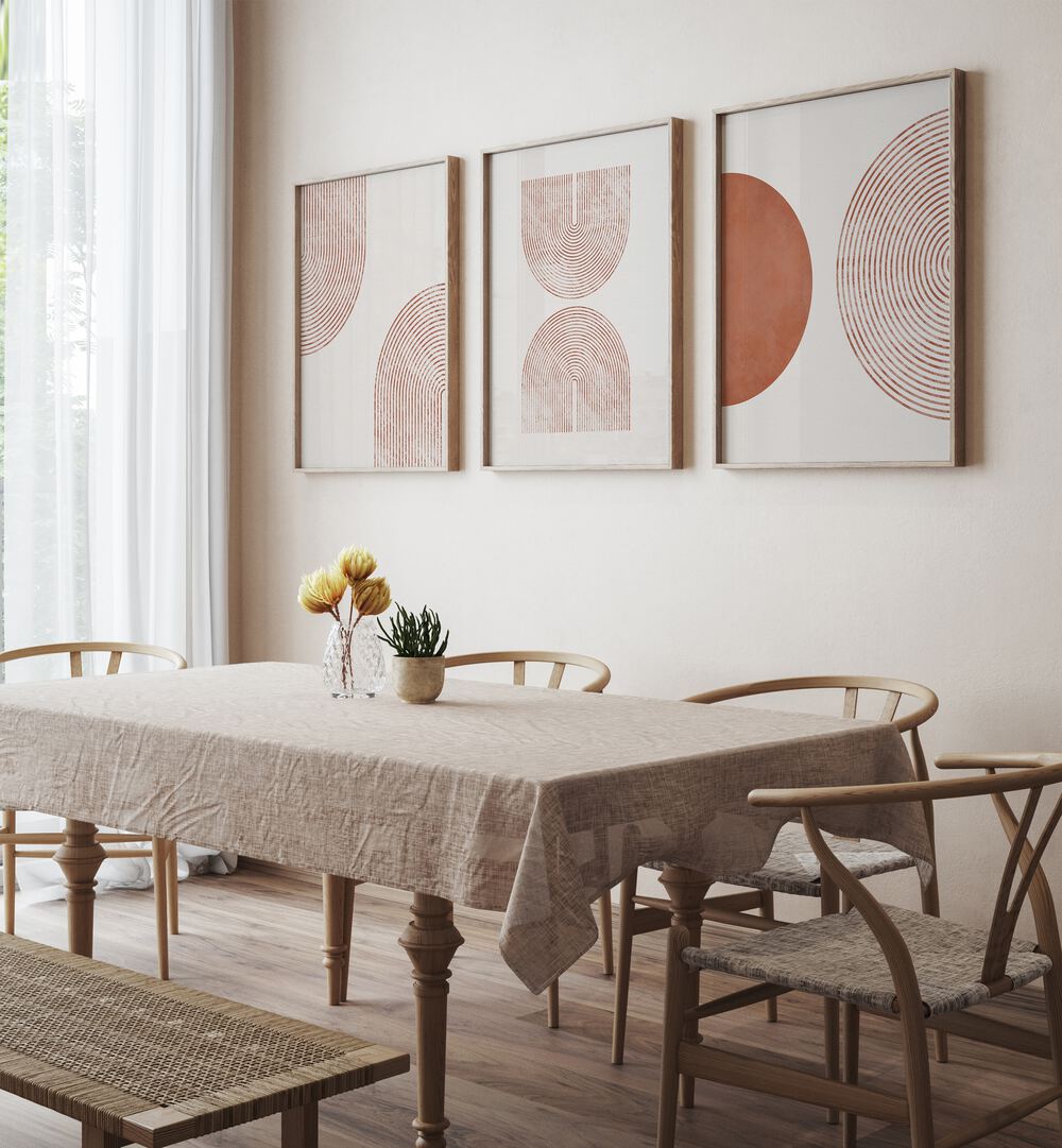 Stylish BOHEMIAN MINIMALIST ARTS, SET OF 3 PAINTINGS enhancing a modern dining space with elegant framed prints.