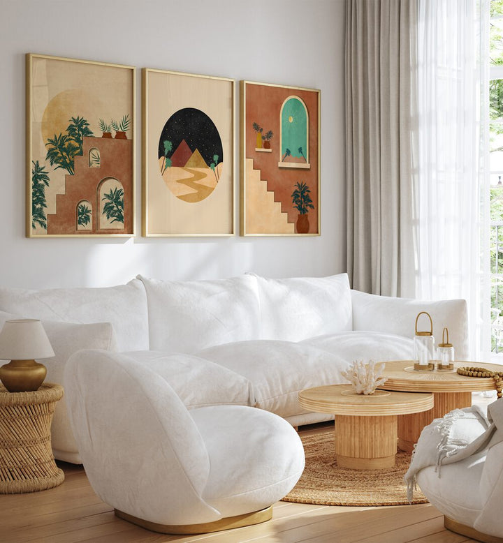 Stylish living room featuring the BOHO DESSERT JOURNEY, SET OF 3 PAINTINGS for a serene desert-inspired decor.