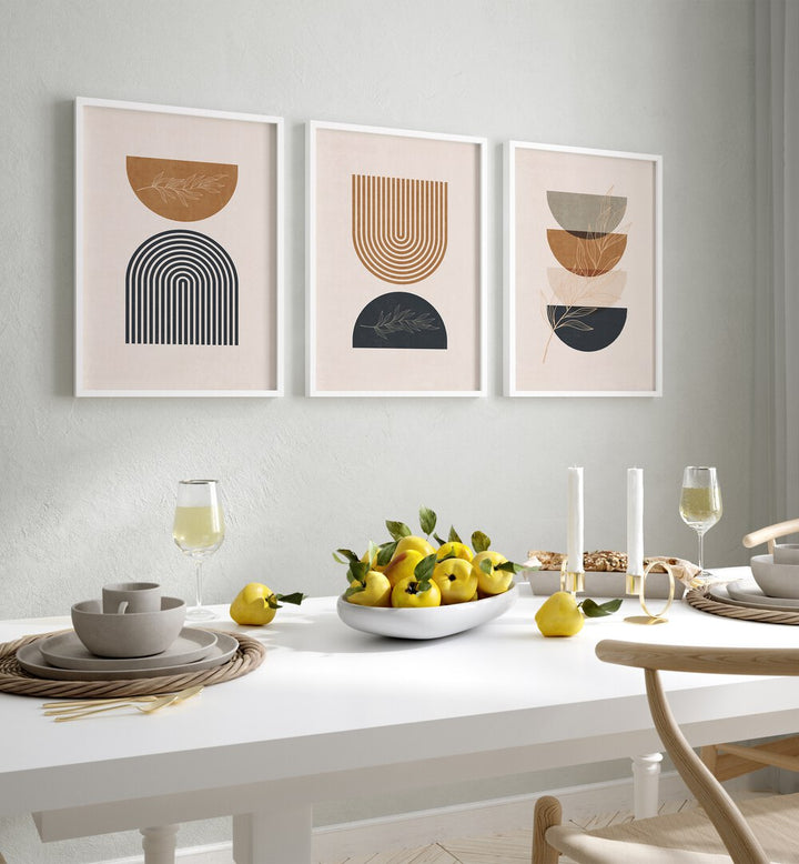 Charming BOHO GEOMETRICAL SHAPES I, SET OF 3 PAINTINGS enhancing a stylish dining space with modern decor.