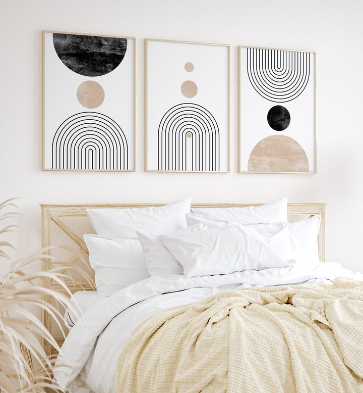 Stylish BOON BOHO LINES, SET OF 3 PAINTINGS enhancing a cozy bedroom with modern boho aesthetics.
