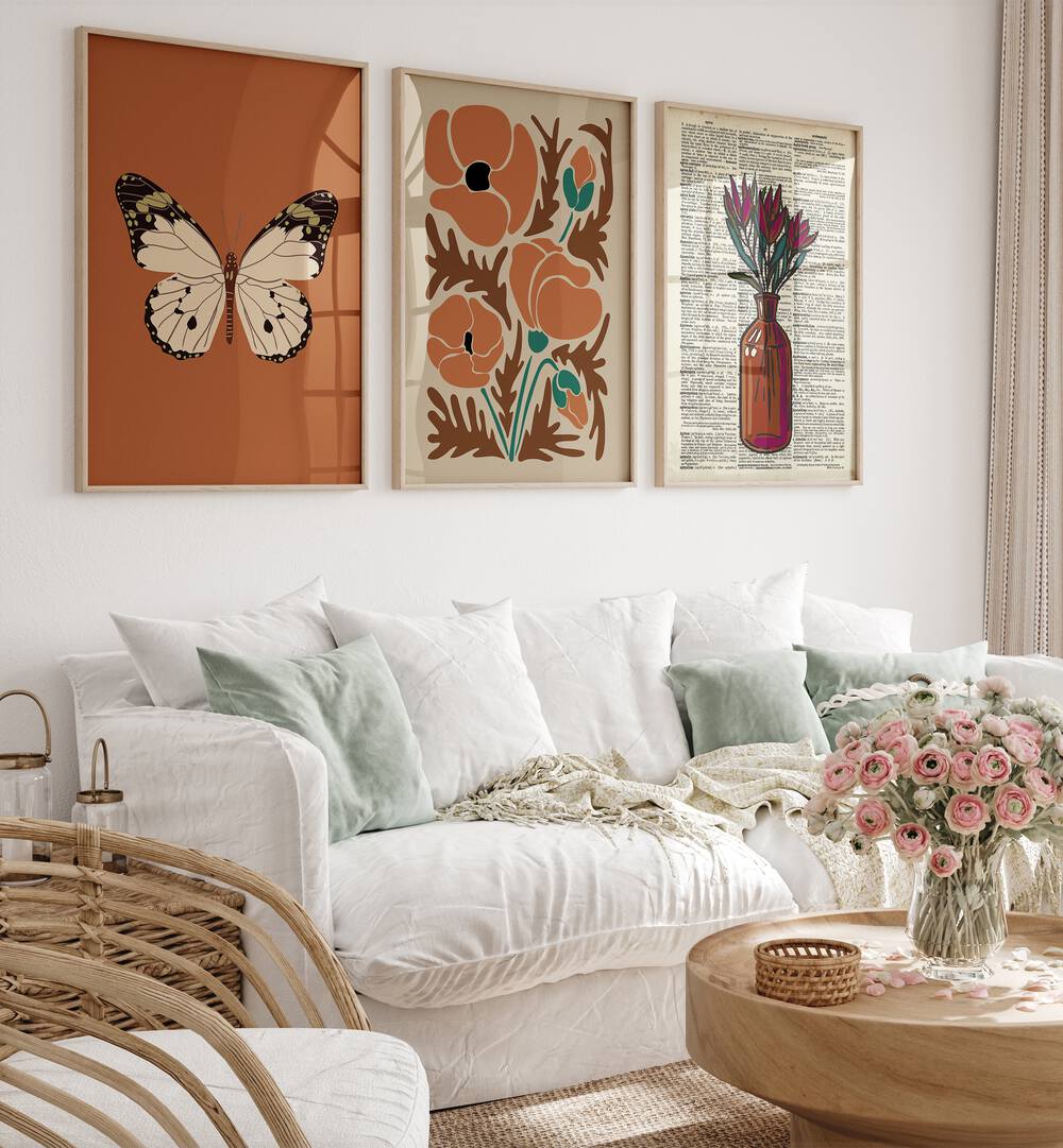 Elegant BOTANICAL SET, SET OF 3 PAINTINGS enhancing a cozy living room with nature-inspired art. Perfect for home decor.