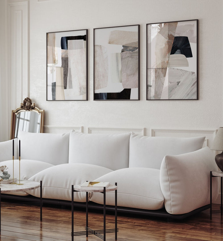 Stylish CLAY CAVES SET, SET OF 3 PAINTINGS enhancing modern living room decor with artistic elegance.