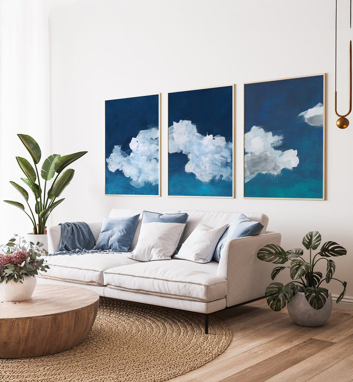 CLOUDS ABSTRACT SET, SET OF 3 PAINTINGS showcases serene cloud designs in calming blue and white hues for your decor.