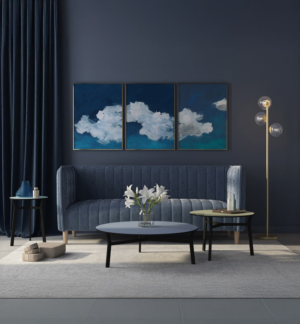 CLOUDS ABSTRACT SET, SET OF 3 PAINTINGS enhances your space with serene blue and white cloud art for a calming atmosphere.