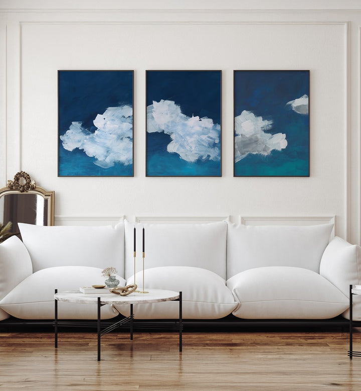 CLOUDS ABSTRACT SET, SET OF 3 PAINTINGS brings serene blue and white cloud art to elevate your living space.