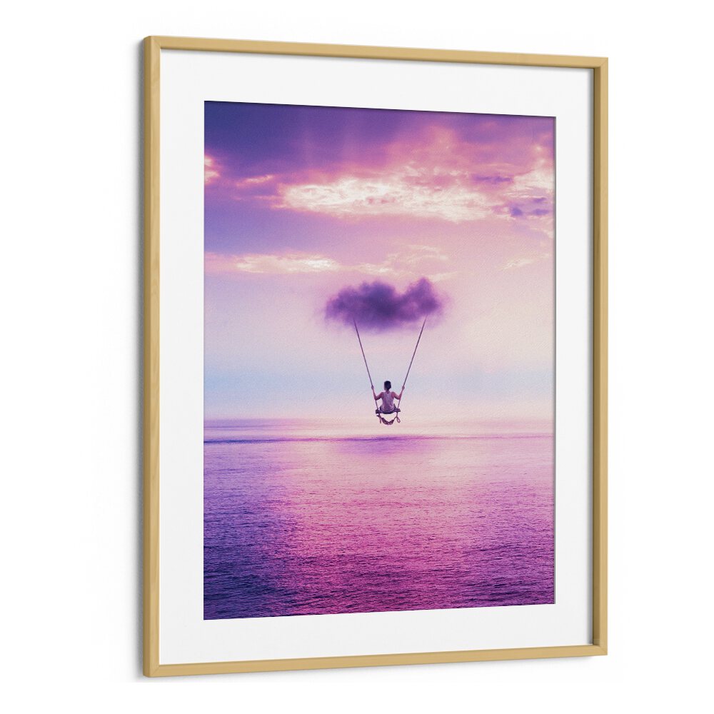 "CLOUD SWING, SURREAL ART PRINTS" by Ritvik Takkar showcases a dreamlike scene of swinging above a serene ocean.