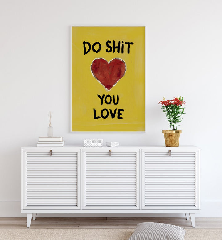 Bright yellow poster featuring "DO SHIT YOU LOVE, QUOTES" to inspire passion and happiness in your space.