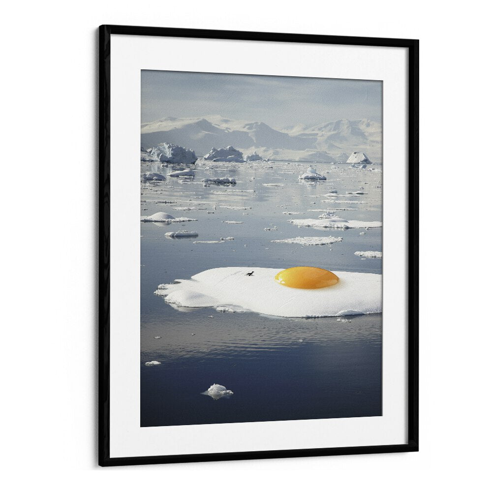 EGG-BERG, SURREAL ART PRINTS featuring a vibrant sunny-side-up egg on an iceberg, framed for artistic elegance.