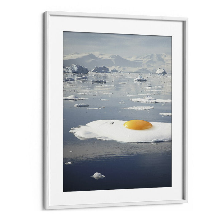Arctic Egg Sunny Side Up artwork in a white frame, part of EGG-BERG, SURREAL ART PRINTS by Vertigo Artography.