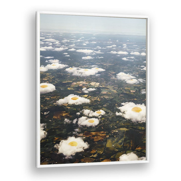 Surreal EGGY CLOUDS art prints by Vertigo Artography showcase whimsical clouds resembling fried eggs above a landscape.