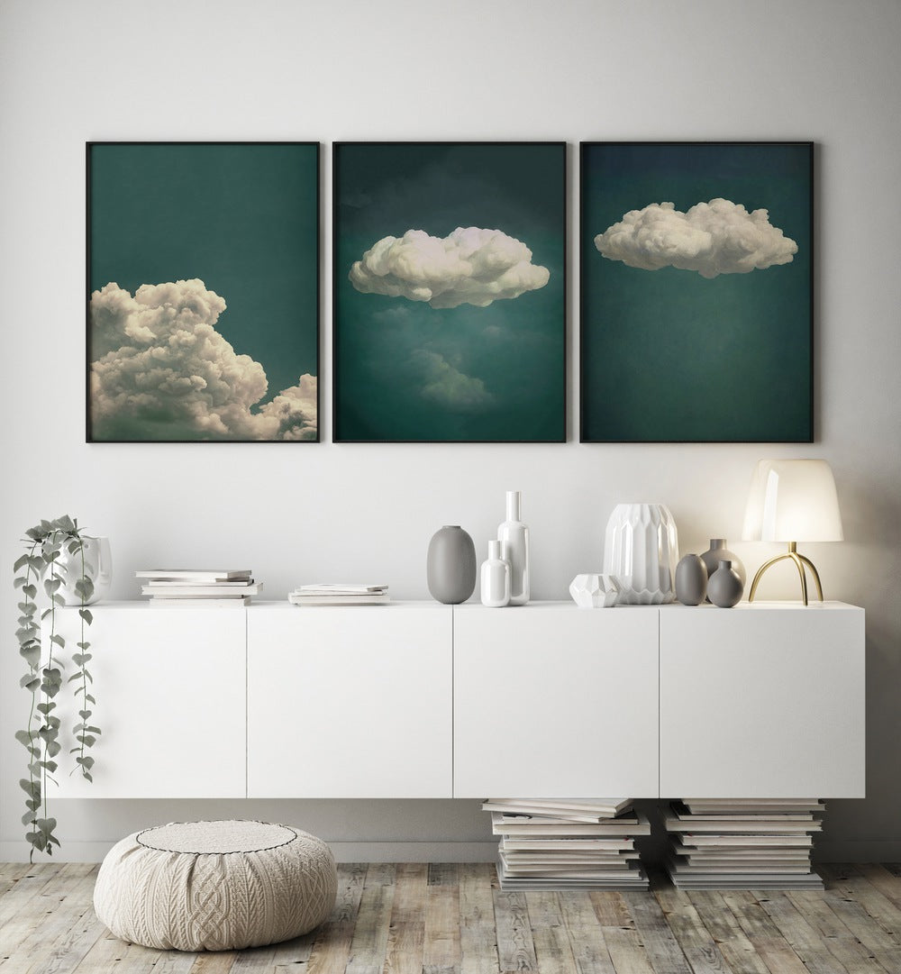 Elevate your decor with the EMERALD CLOUDS SET, SET OF 3 PAINTINGS featuring serene emerald hues and soft clouds.
