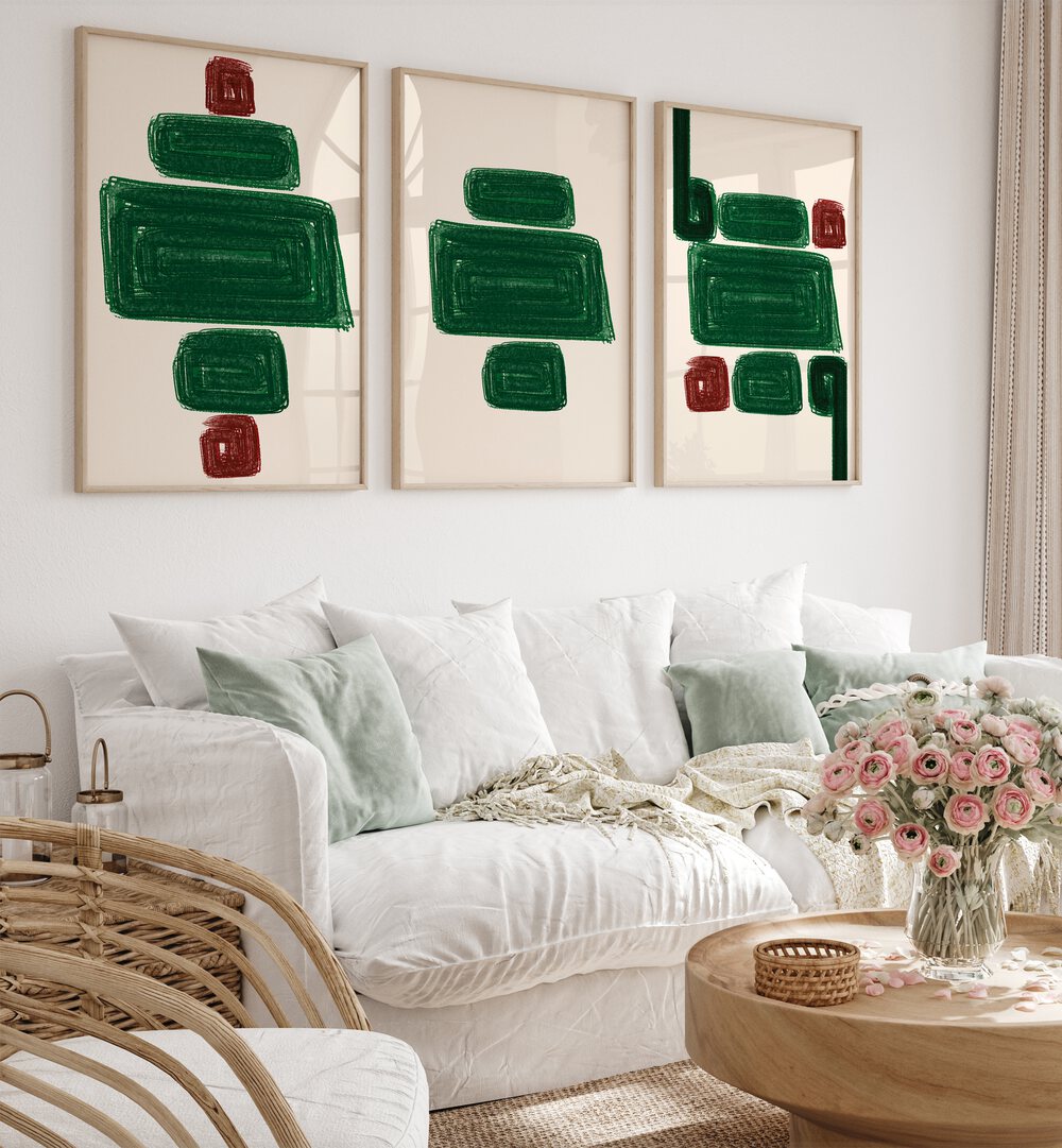 Stylish EMERALD SET, SET OF 3 PAINTINGS enhancing a cozy living room with elegance and sophistication.
